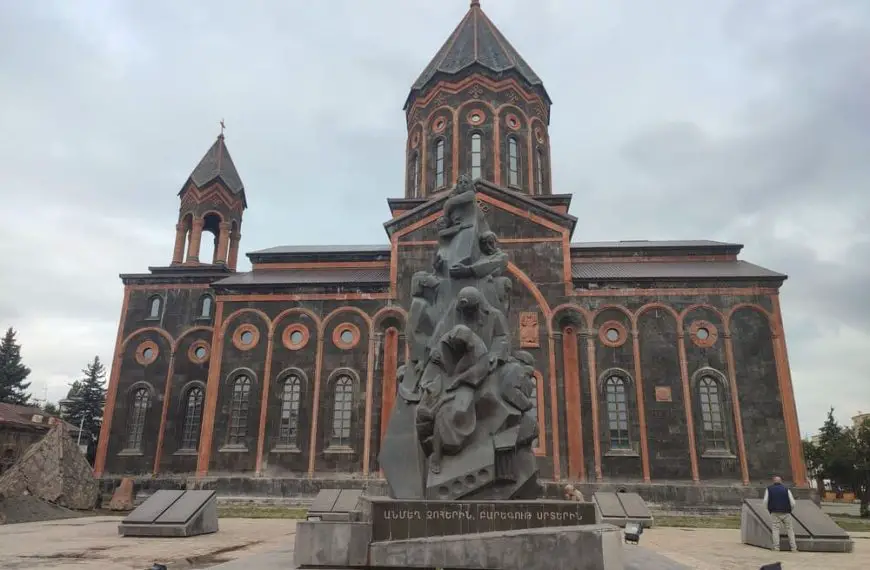 Gyumri Cathedral with the small statue in front of it.