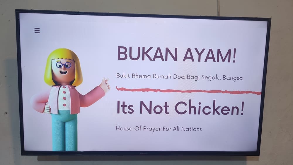 "It's not chicken" sign inside the House of Prayer for All Nations