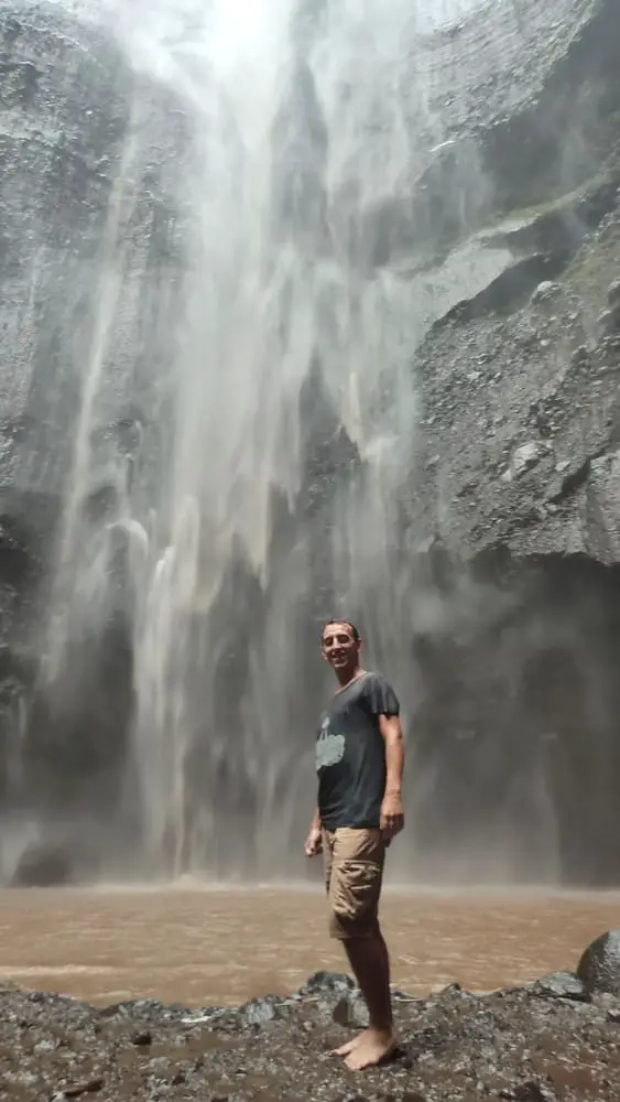 Simon in front of Madakaripura Waterfall 
