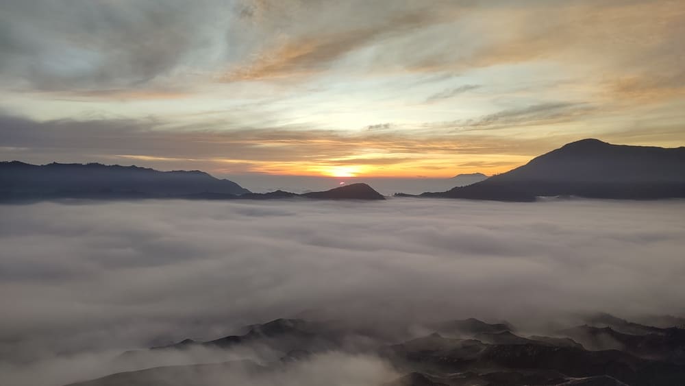 Sunrise at Mount Bromo and a sea of clouds underneath