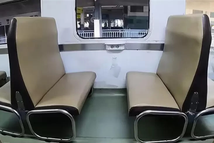 Benches facing each other as the seasting arrangement in economy class in a train in Indonesia