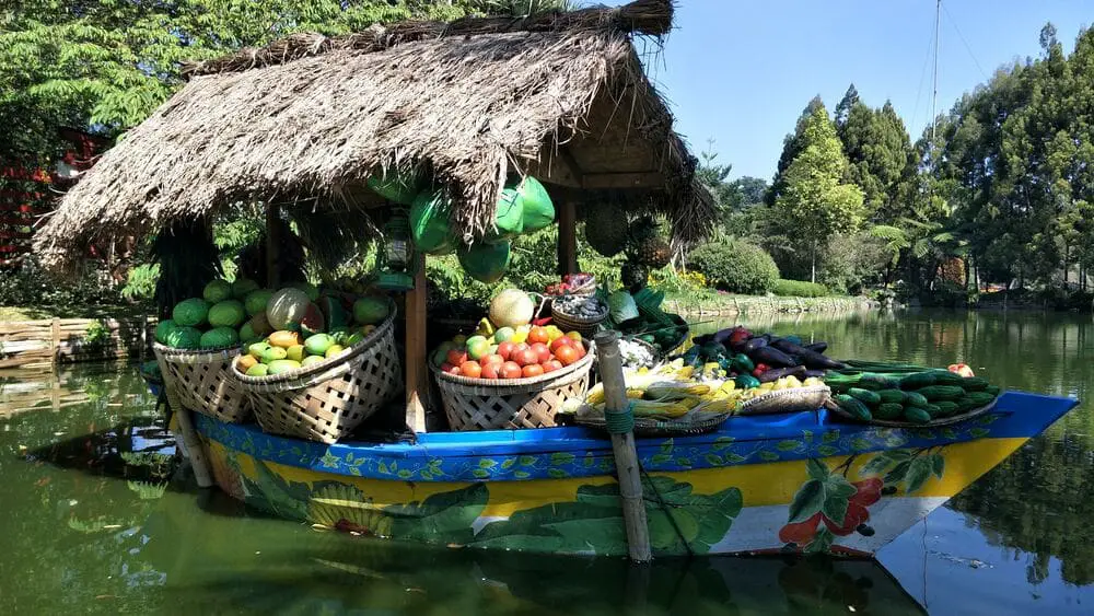 Boat with vegetables and fruits in the Lembang Floating Market, part of this Java Backpacking Itinerary