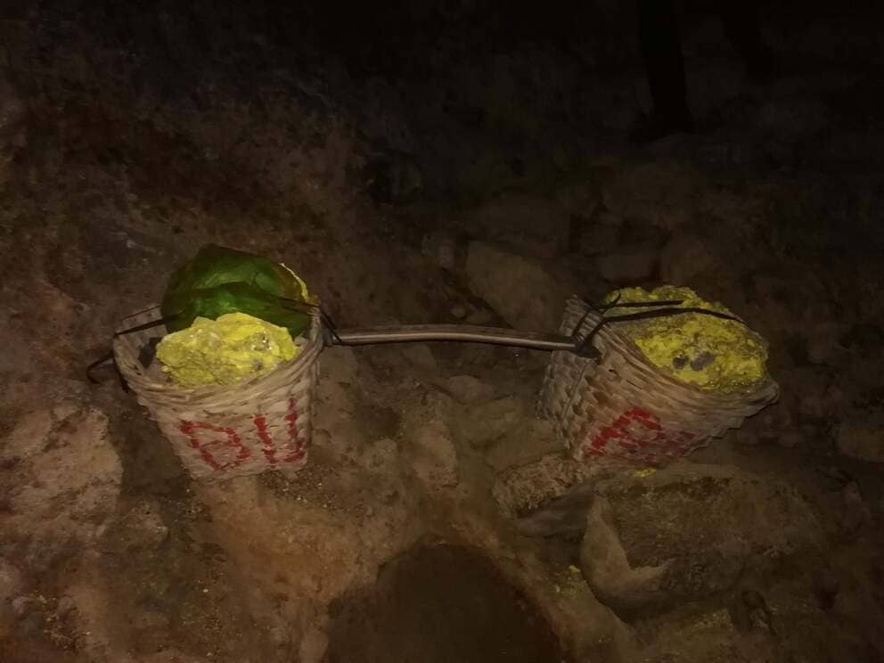 Sulfur Mining at Kawah Ijen: two buckets on sulfur