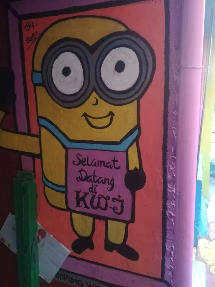KWJ Kampung welcome sign with a minion