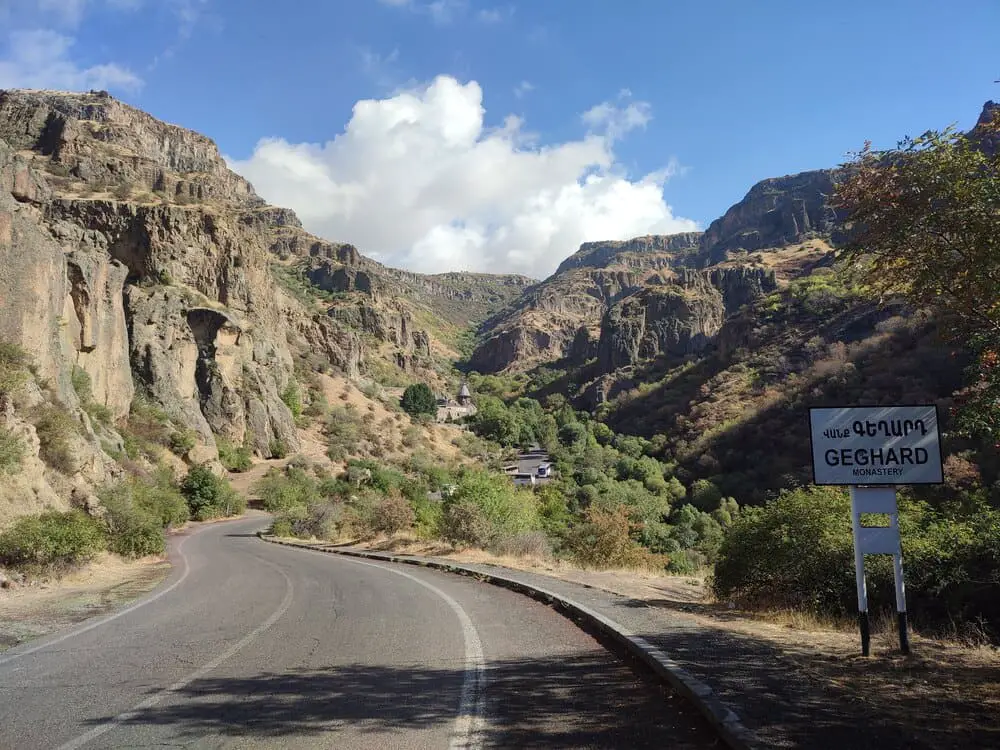 The road towards Geghard Monastery with the sign for it on the left.