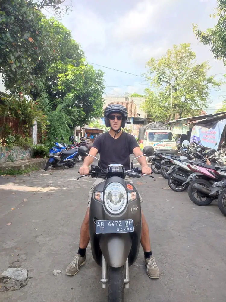 Simon on a scooter in Indonesia