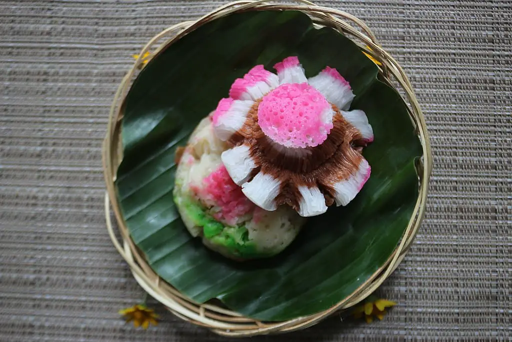 Bikang dessert in a small tray over a banana leaf.