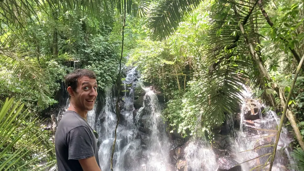 Simon in front of Kanto Lampu waterfall