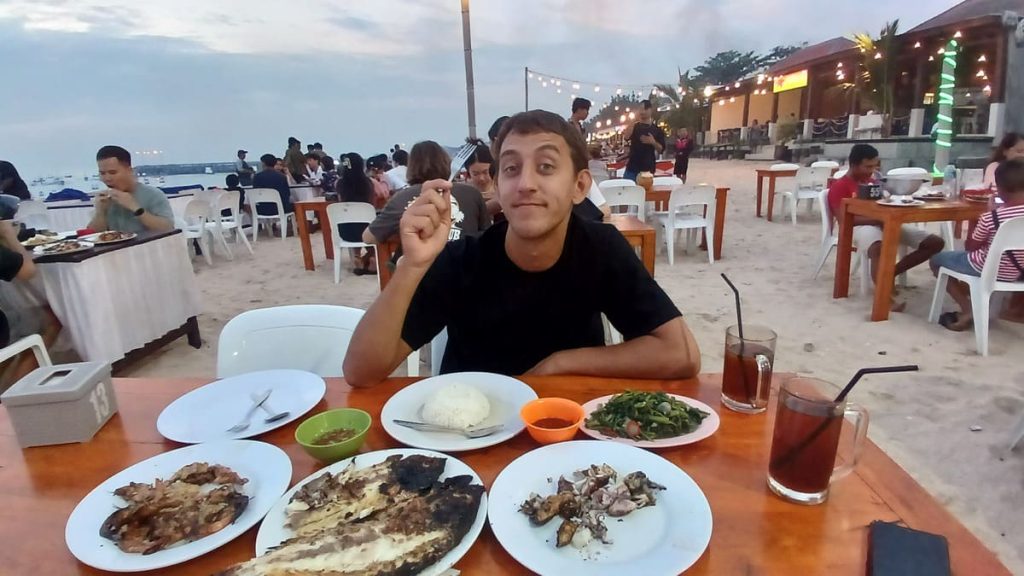 Simon eating seafood at Jimbaran beach