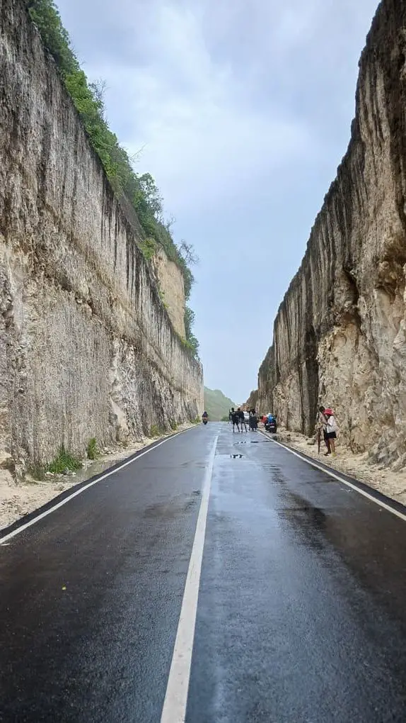Tanah Barak high cliffs and the wet asphalt