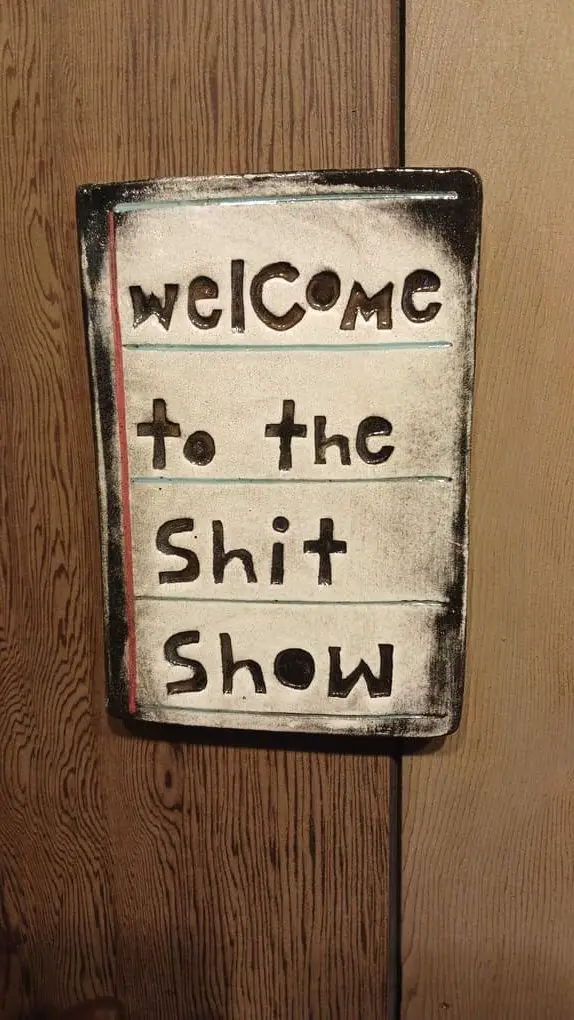 a sign that reads "Welcome to the shit show".