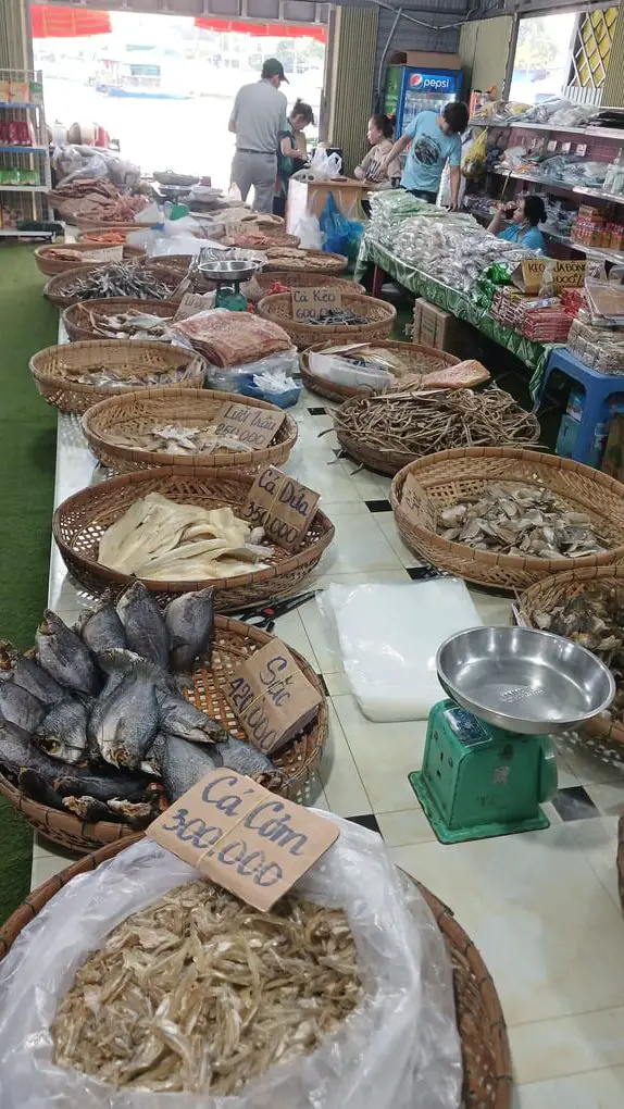 dried fish sold in a shop at the floating market
