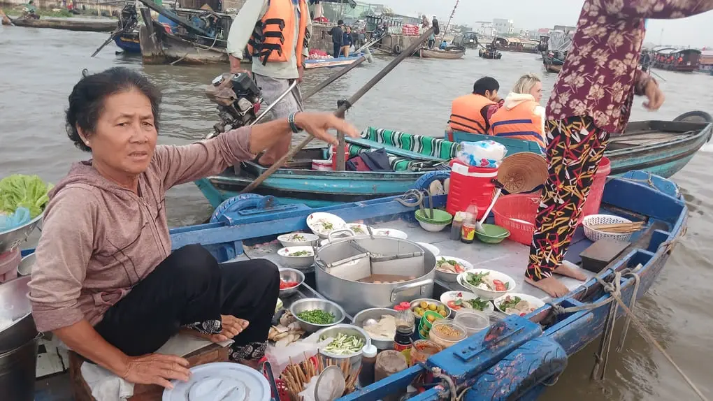A boat serving noodles inside the Cai Rang Floating Market