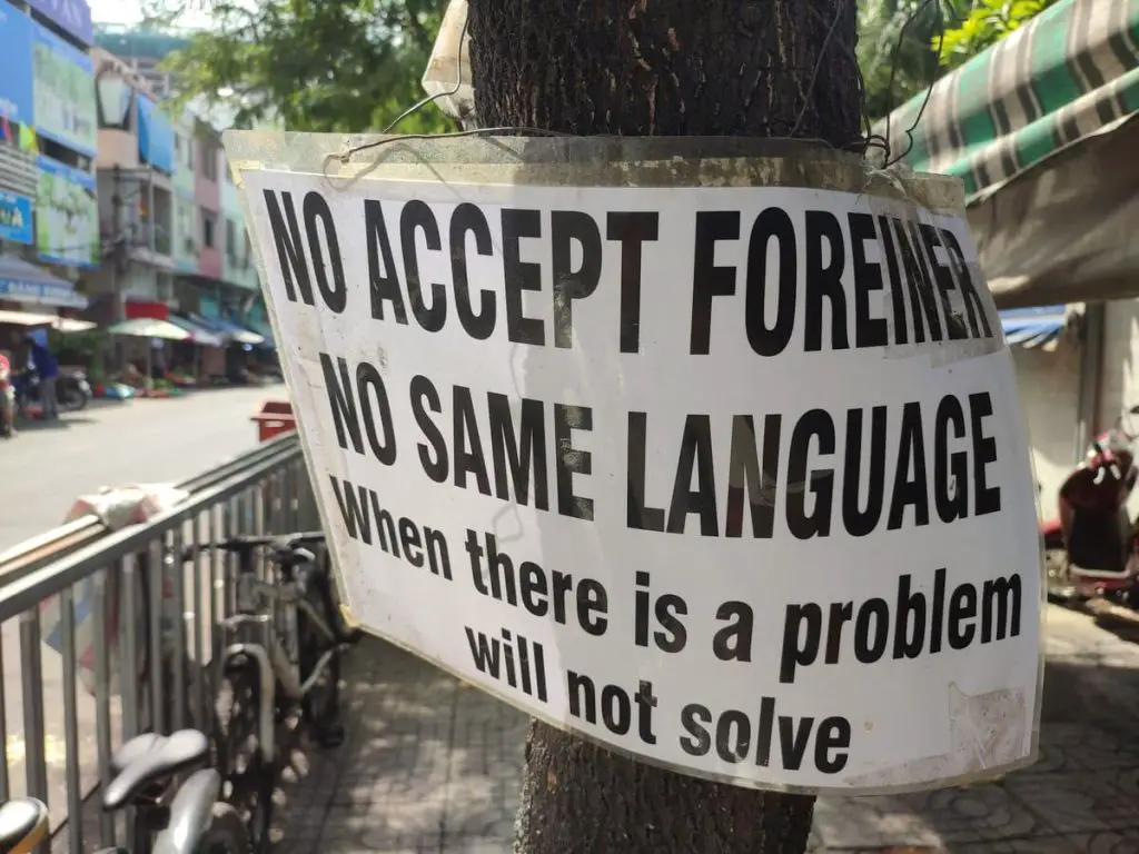 A sign in Vietnam that reads "No accept foreigners. No same language. When there is a problem will not solve."
