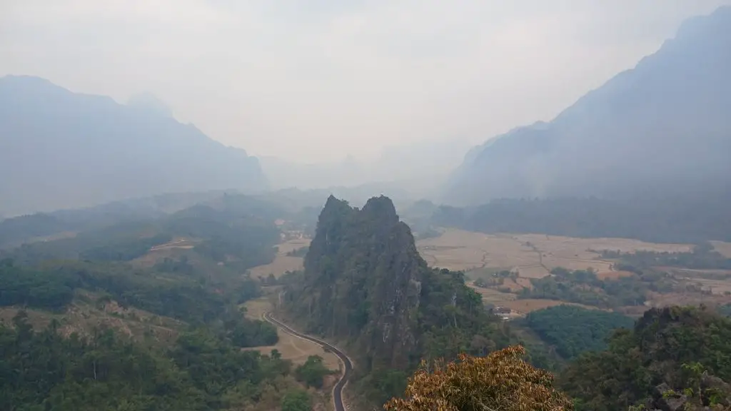 The hazy view from the top of Nam Xay Viewpoint in Vang Vieng
