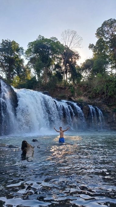 Simon swimming in Tad Lo Waterfall