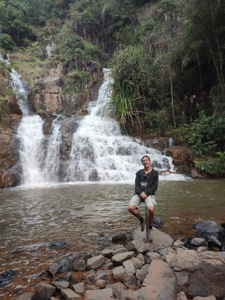 Datanla waterfall and simon sitting on an elevated seat