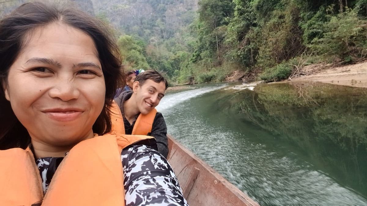 Yulli and Simon on a boat in Kong Lor Cave