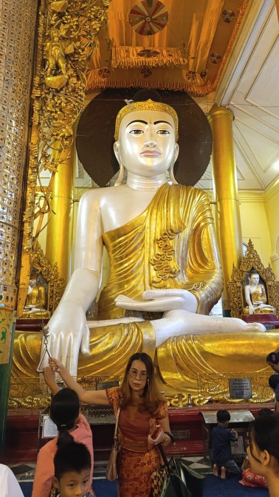 Giant Buddha with a brass circle behind his head