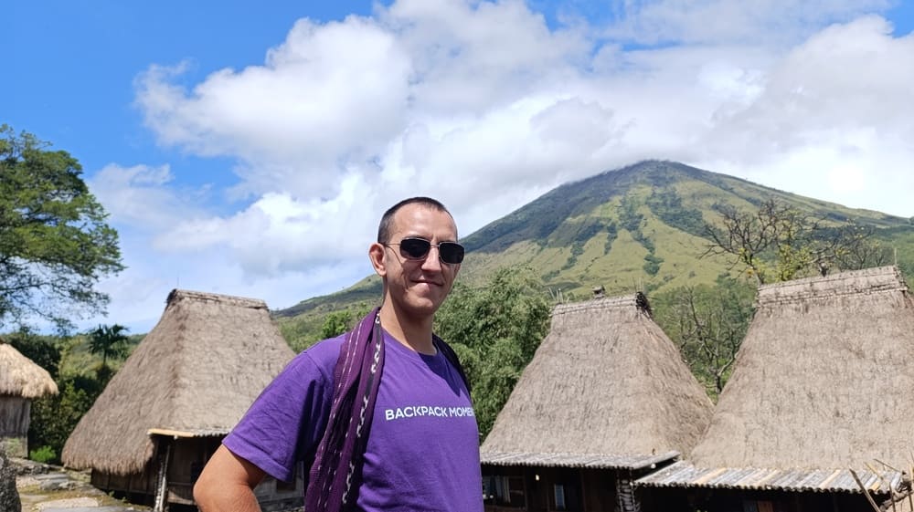 Simon in Bena village, with Mount Inerie as a backdrop