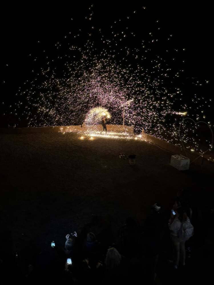 The fire juggler's trick of spreading fire and sparks in an arc around himself.