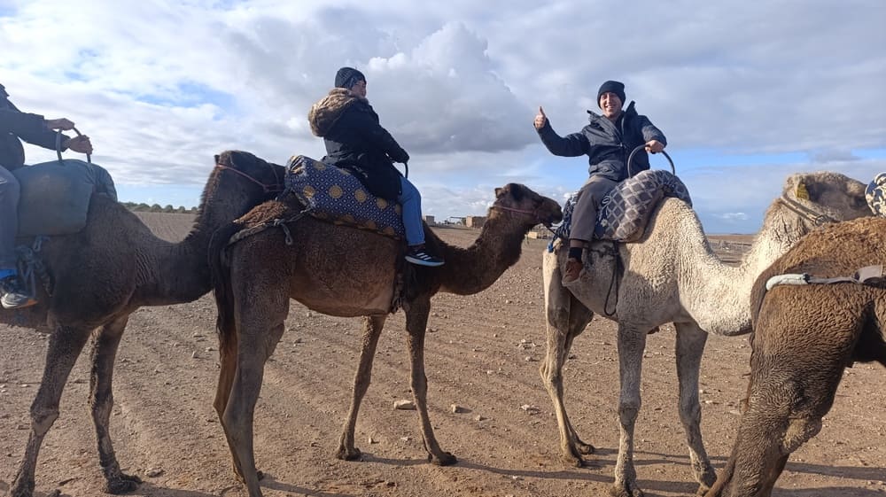 Simon on a camel in the Agafay Desert