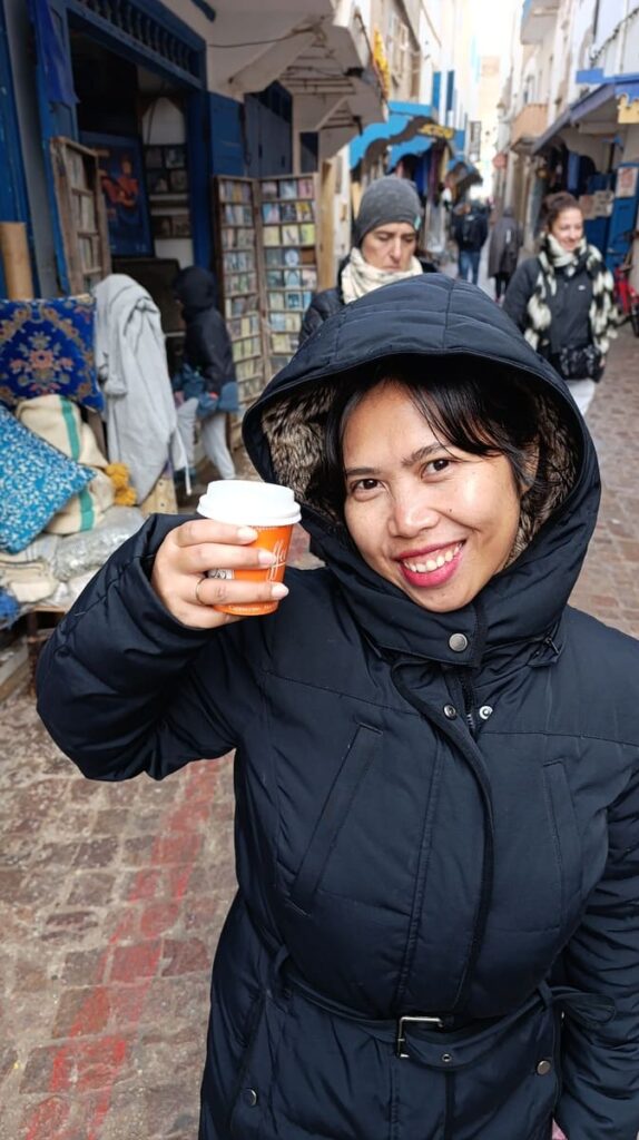 Yulli posing with her coffee in Essaouira