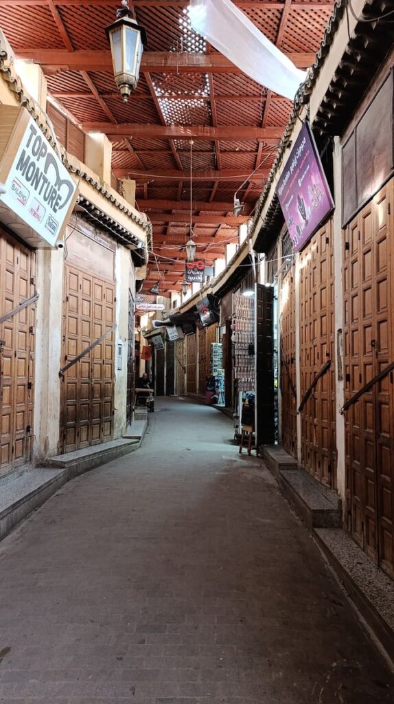 A suk lined with closed shops and a roof in Fes.