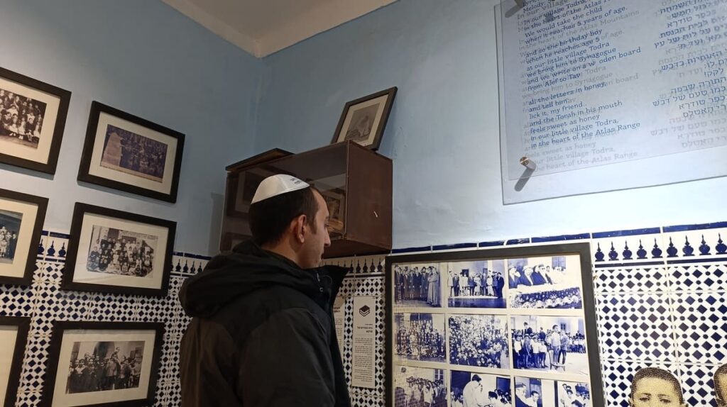 Simon wearing a kippah inside a synagogue