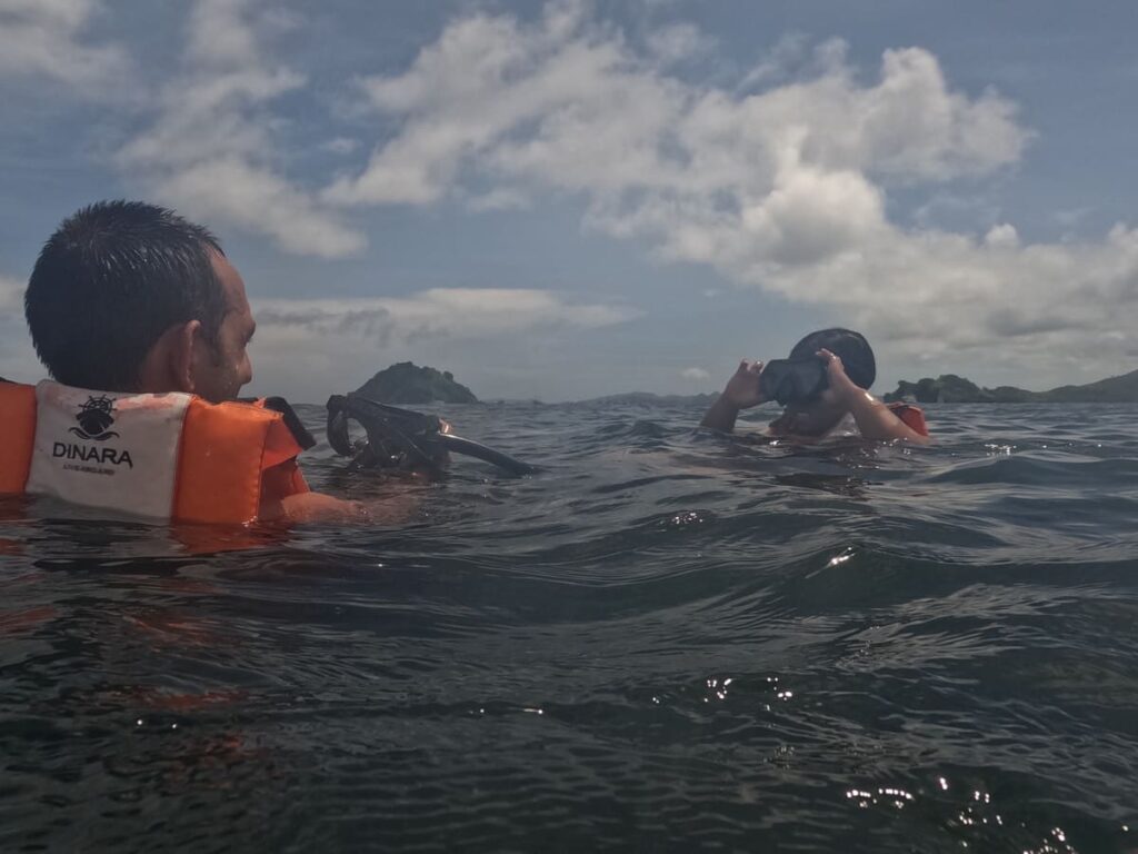 Simon and Yulli snorkeling near Kanawa Island. Snorkeling is one of the must do activities while sailing in the Komodo National Park.