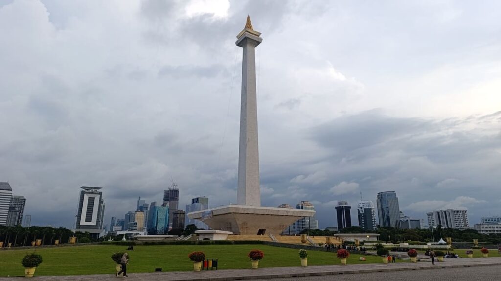 The National Monument (MONAS) in Jakarta - a concrete pillar with a golden flame on top.